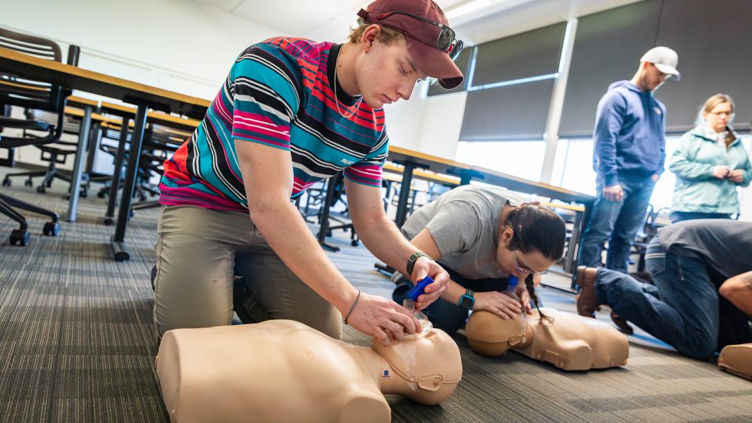CPR class students with manquins.