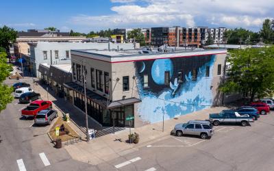 An aerial view of the Aims Loveland campus showing a blue mural with white doves flying