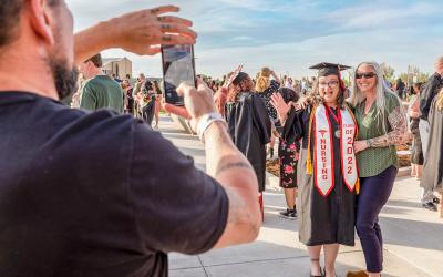 A nursing student celebrates at commencement 2022