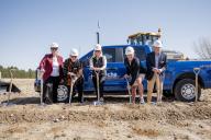 People with shovels at groundbreaking ceremony