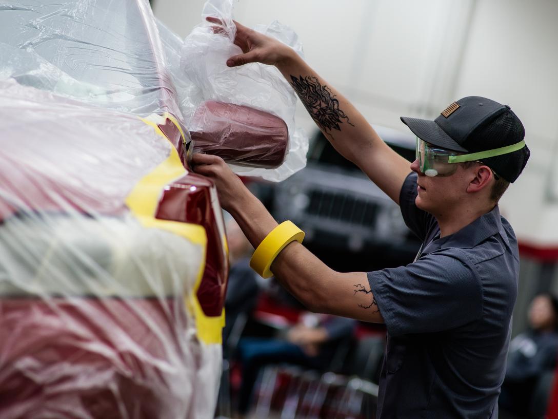 Drew Ayres working on vehicle at Skills USA
