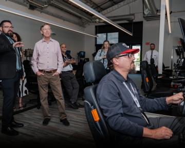 Hickenlooper watches flight simulator presentation