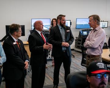 Hickenlooper visits with Aims Aviation Staff