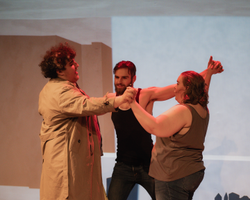 3 students in a circle during Lysistrata dress reherals