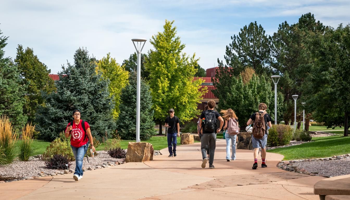 Students walking on an outdoor path at Aims Greeley campus fall 2024